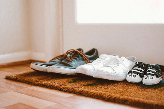 Shoes sitting on a rug at the front entrance